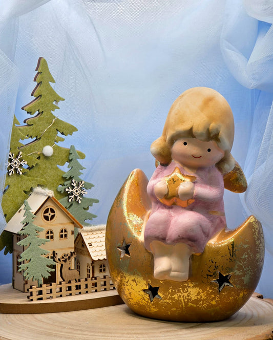 Statuina angelo seduto sulla  luna